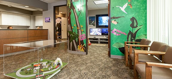 View of waiting area with a jungle painted on the wall